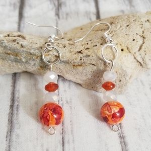 Orange and white glass bead dangle earrings
